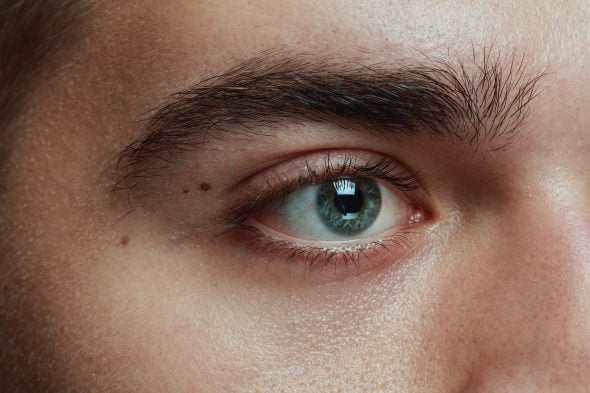 Close-up portrait of young man eye