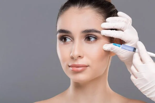 white woman having a Tear Trough Filler